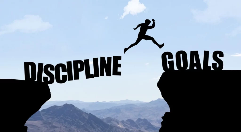 “Personne franchissant un gouffre symbolisant la discipline”